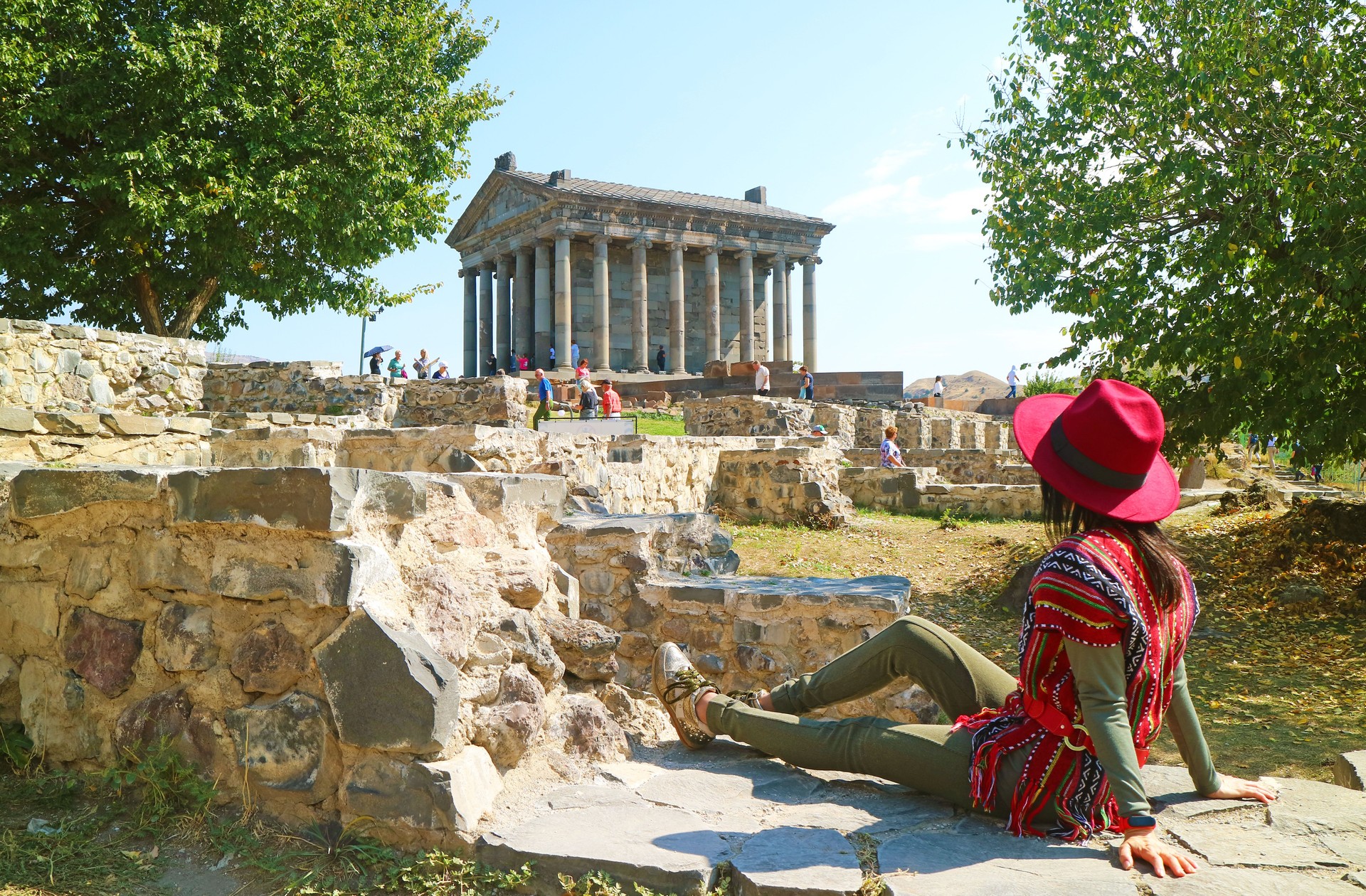 Female Visitor Enjoying Impressive View of the Ancient Garni Pagan Temple in Kotayk Province, Armenia