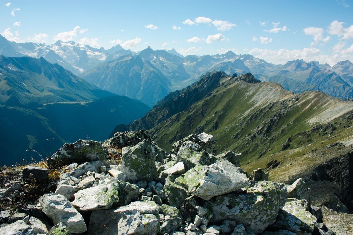 Mountain summer landscape with forest and high peaks. Caucasus. A view of the main Caucasian ridge. Biosphere Reserve resort Dombay. The concept of travel and tourism.