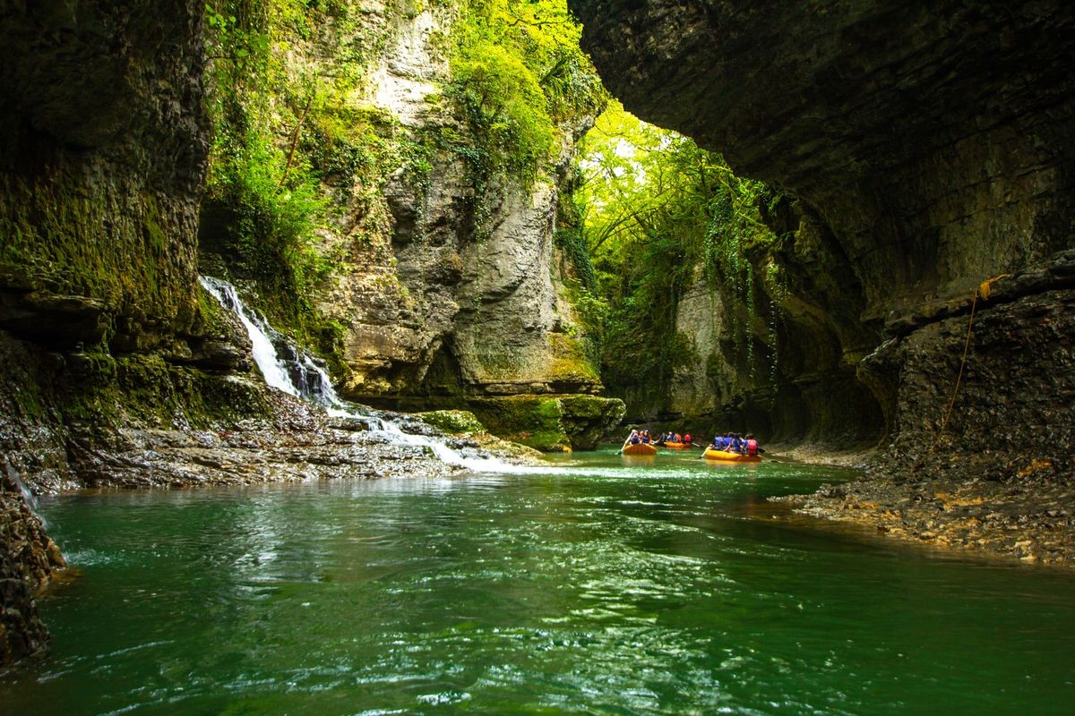 Amazing view on boat tour of the picturesque Martvili canyon in Georgia near Kutaisi. Beautiful natural canyon with view of the mountain river, christal blue water and boat ride.